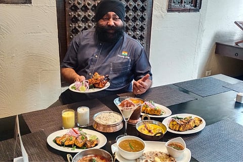 Chef Sweety Singh with his created menu