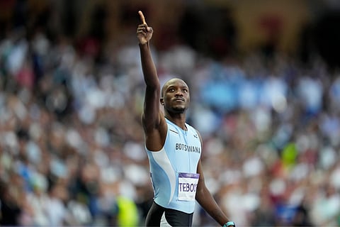 Letsile Tebogo, of Botswana, gestures after winning the gold medal in the men's 200 meters final at the 2024 Summer Olympics (Aug. 8) in Saint-Denis, France