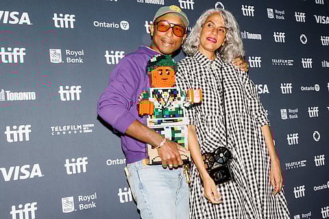 Pharrell Williams and Mimi Valdez arrive on the red carpet for the premiere of 'Piece by Piece' at the Princess of Wales Theatre during the Toronto International Film Festival in Toronto, on Sept. 10, 2024