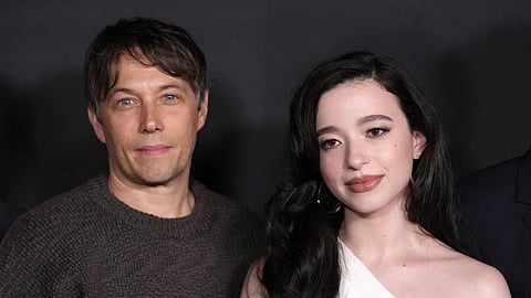 Sean Baker and Mikey Madison pose at the Los Angeles premiere of Anora