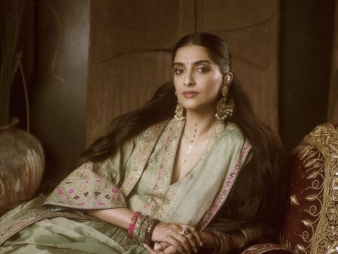 Sonam Kapoor looks like a dream in a green tissue lehenga and a long jacket