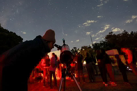 People attend a stargazing and comet-watching gathering at Joya-La Barreta ecological park as comet Tsuchinshan–ATLAS flies overhead in Queretaro