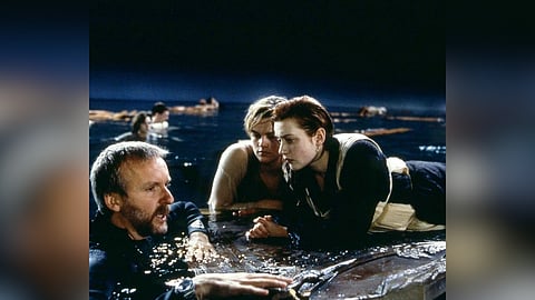 (L-R) James Cameron, Lenardo Dicaprio and Kate Winselt in a BTS glimpse shared by The Academy in 2022