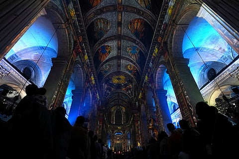 Video projections are seen Thursday Oct.31, 2024 at the Saint-Sulpice church in Paris