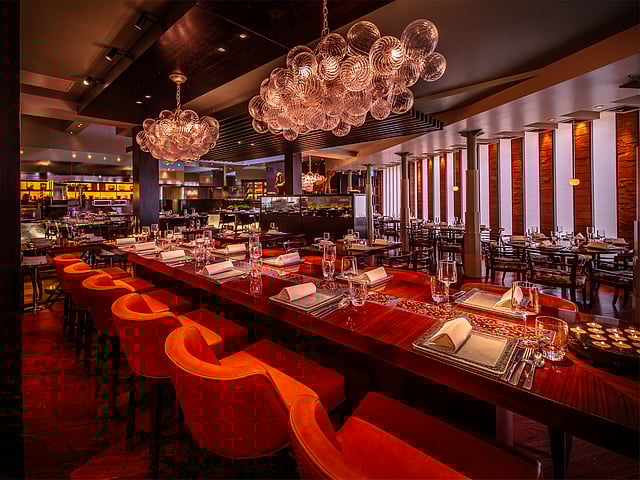 Interiors at Amaya, showing open kitchen in the rear