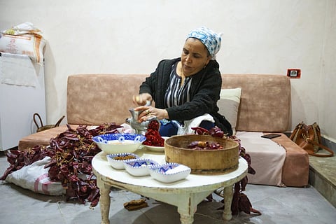 Chahida Boufaied, owner of Dar Chahida Lel Oula, prepares the Harissa in her house in Nabeul, Tunisia