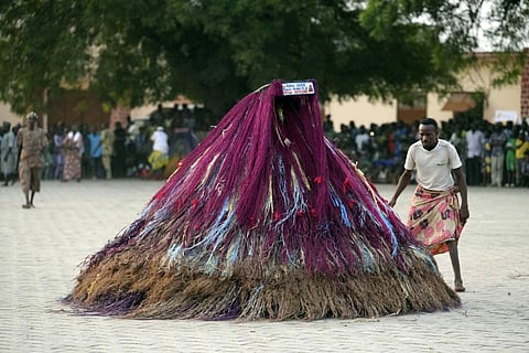 Zangbeto masquerade the traditional Voodoo guardians of the night performing ahead of the annual Voodoo Festival in Ouidah, Benin
