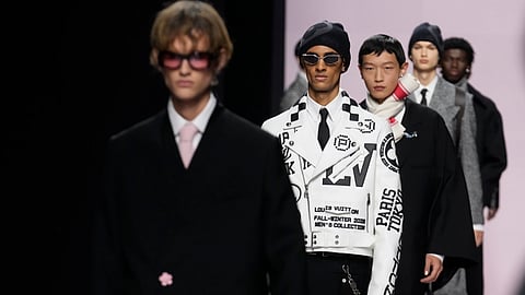 Models wear creations as part of the men's Louis Vuitton Fall-Winter 2025-2026 collection which was presented in Paris