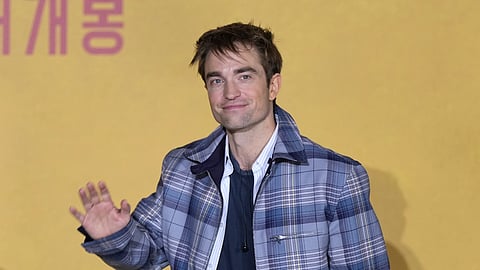 Actor Robert Pattinson leaves after a news conference for Mickey 17 in Seoul, South Korea, Monday, Jan. 20, 2025.