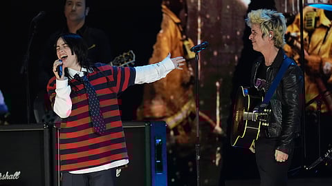Billie Eilish, left, performs with Billie Joe Armstrong of Green Day during the FireAid benefit concert