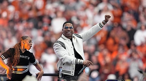 Entertainer Nelly performs at halftime of the Big 12 Conference championship NCAA college football game between Oklahoma State and Texas in Arlington