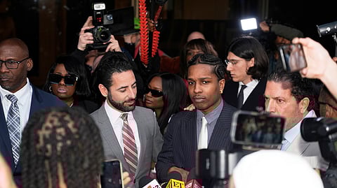 A$AP Rocky, center right, speaks next to attorney Chad Seigel after he was found not guilty in his trial
