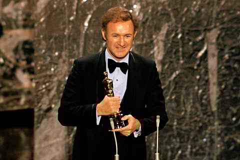 FILE - Gene Hackman accepts his Oscar for best actor at the 44th Academy Awards in Los Angeles on April 10, 1972