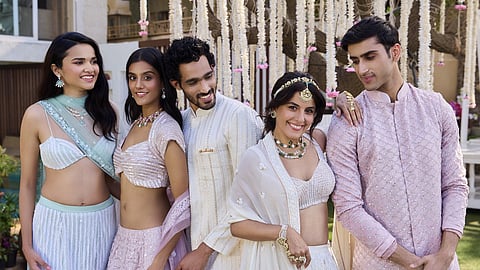 Actress Isha Talwar along with models wearing pieces from Raj Rani