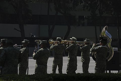A military band performs a corrido during a performance for the media at a military base in Mexico City, Monday, March 10, 202
