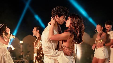 Ishaan Khatter & Bhumi Pednekar share an intimate embrace on a dancefloor in a still from Netflix’s The Royals