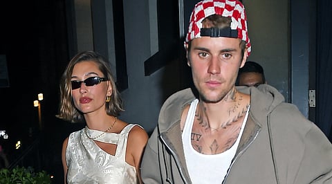 Why are fans speculating if Hailey Bieber's business decision was influenced by Justin Bieber's monetary struggles?