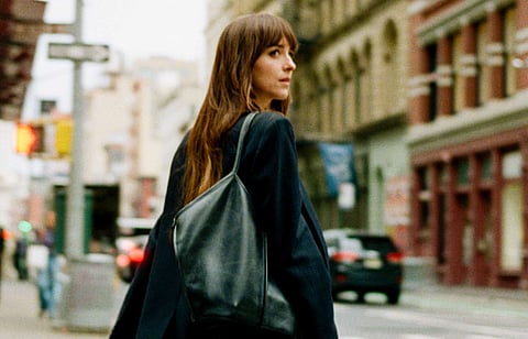 Dakota Johnson carries a Hereu tote bag in Materialists