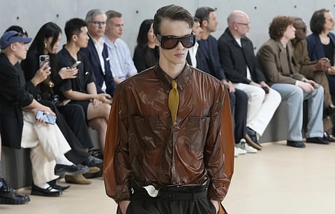 A model walks the ramp at the YSL menswear show