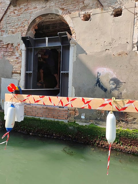 Banksy work The Migrant Child removed from Venetian palazzo for restoration and future display