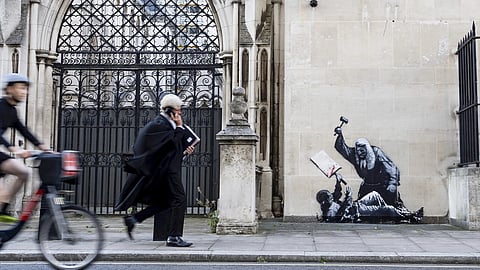 Banksy mural at London’s Royal Courts swiftly erased