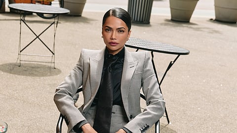 Mona wearing Alexander McQueen suit