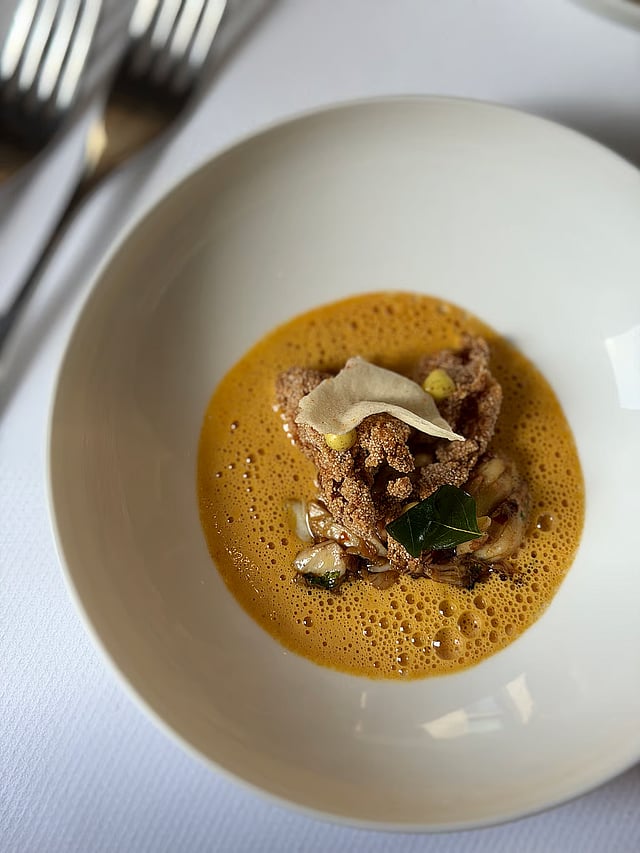 Pumpkin bitterballen in mustard coconut sauce, adish from a tasting menu