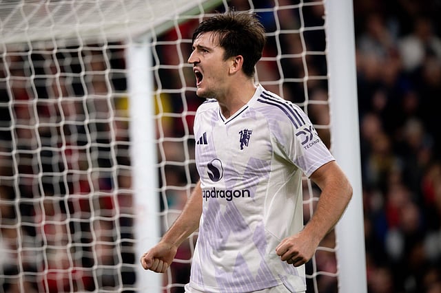 Harry Maguire celebrates after scoring the winner against Liverpool