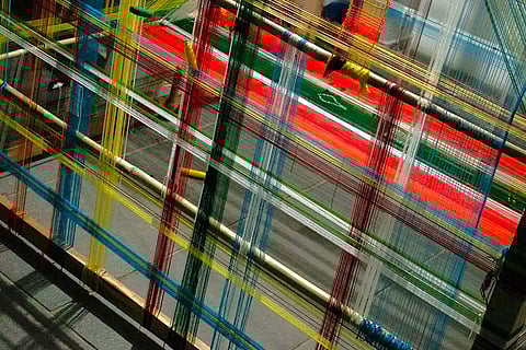 The art exhibition in the city reflects on the journey of textiles through multiple realms.