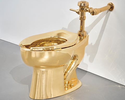 This Sept. 16, 2016 file image made from a video shows the 18-karat toilet, titled America,