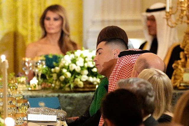 Cristiano Ronaldo, center, attends a dinner with President Donald Trump and Saudi Arabia's Crown Prince Mohammed bin Salman in the East Room of the White House