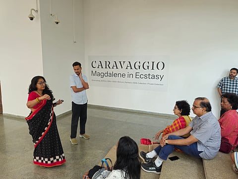 Attendees experience the flow from canvas to glass to verse at the event.