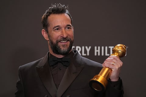 Noah Wyle poses in the press room with the award for best performance by a male actor in a television series – drama for The Pitt during Golden Globes 2026