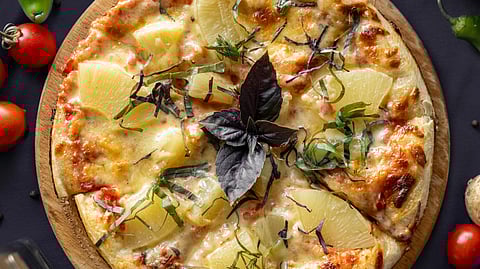 How did pineapple pizza originate?