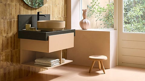 Balcoon combines layered architecture, warm terracotta ceramics, and sleek faucets for serene contemporary bathroom environments