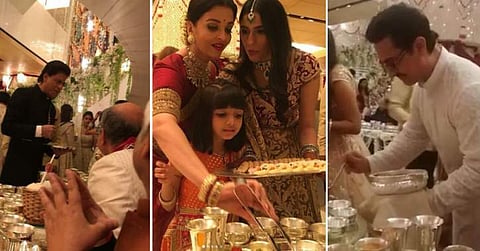 Twitter trolls Bollywood celebrities for serving food at Isha Ambani's wedding, Abhishek Bachchan responds