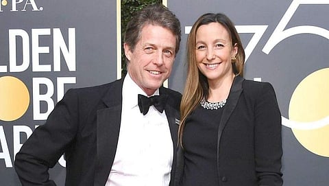 Hugh Grant and Anna Eberstein