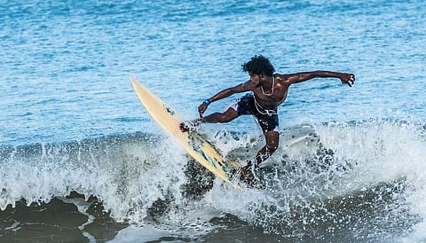 One of the many surfers at Covelong Point
