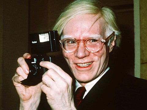 In this file photo dated 1976, showing pop artist Andy Warhol smiles in New York. (AP Photo/Richard Drew, FILE)
