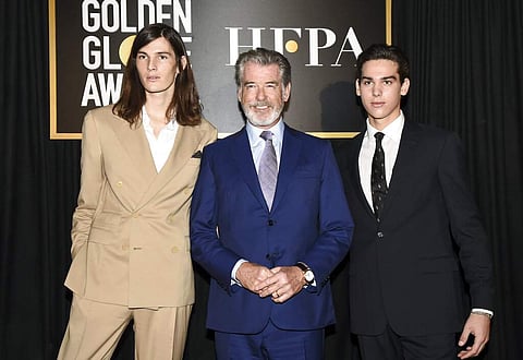 Dylan Brosnan, from left, Pierce Brosnan, and Paris Brosnan attend the Golden Globe Ambassador reveal (Photo by Dan Steinberg/Invision/AP)