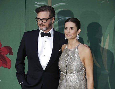 Colin Firth and his wife Livia (AP Photo/Luca Bruno)