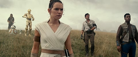 Daisy Ridley flanked by Oscar Isaac and John Boyega in a still from Star Wars: The Rise of Skywalker