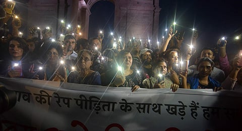A candle light protest in New Delhi (Photo: IANS)