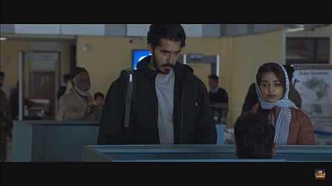 Dev Patel and Radhika Apte in The Wedding Guest