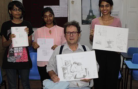 Jacques Servieres with some of his works