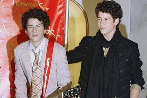 Nick Jonas with his wax statue
