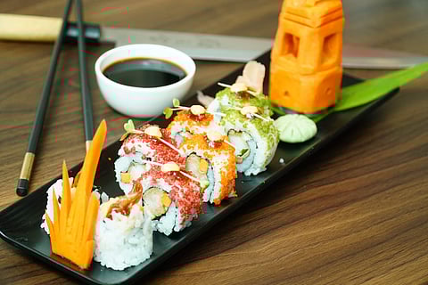 Ebi Uramaki, Japanese vinegar flavoured rice wrapped and garnished with Tempura Fried Prawn