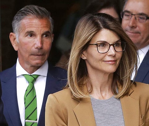 File photo: Lori Loughlin and Mossimo Giannulli (AP Photo/Steven Senne)