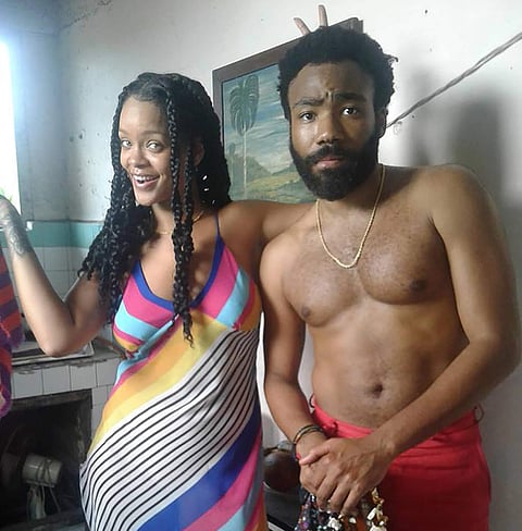 Rihana and Childish Gambino on set