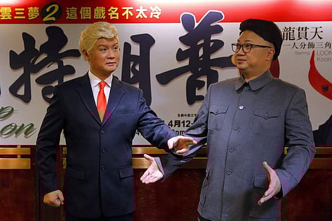 File photo: Hong Kong actors Chan Hung-chun and Lung Koon-tin dressed as Kim Jong Un and Donald Trump. (AP Photo/Kin Cheung, File)